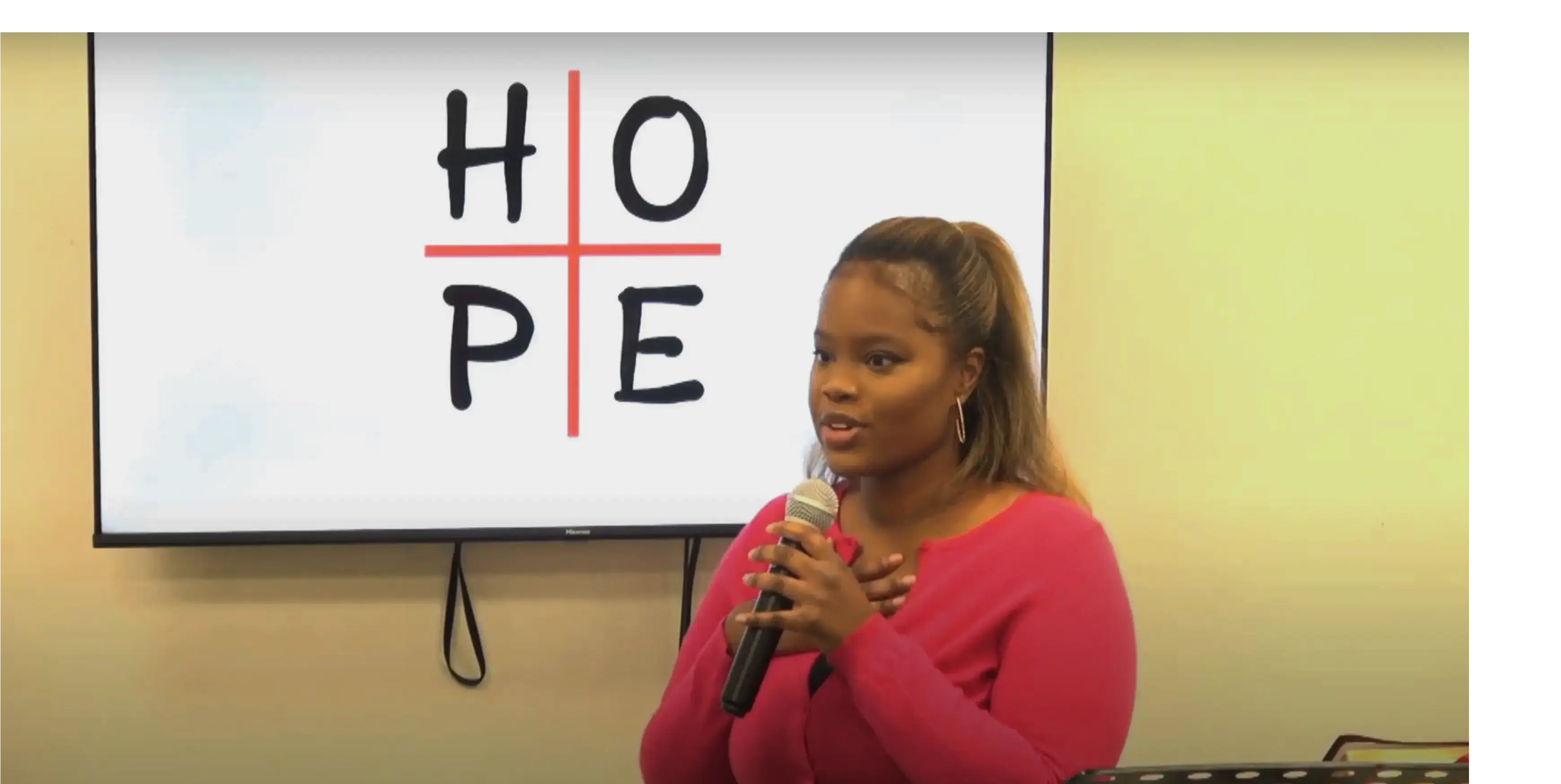 woman in pink cardigan